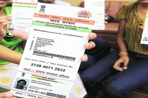 Govt backs mandatory Aadhaar for issuing PAN card