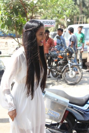 Poonam Pandey Distribute Raincoats To Street Children