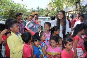 Poonam Pandey Distribute Raincoats To Street Children