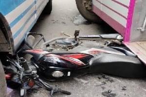 Men escape death as bike falls between two buses