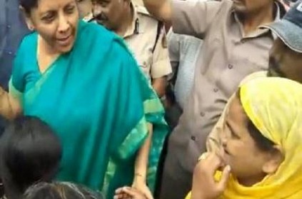 Nirmala Sitharaman stops car walks up to woman who throws paper