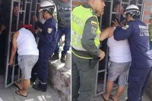 Spying? Woman's head stuck in metal gate. Check the reason!