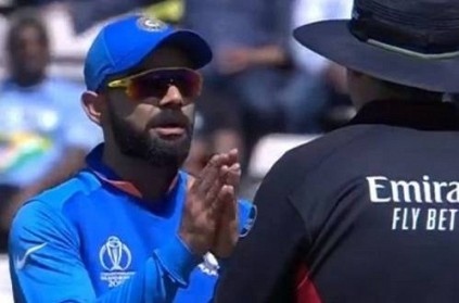 Kohli argues with umpire over DRS with folded hands