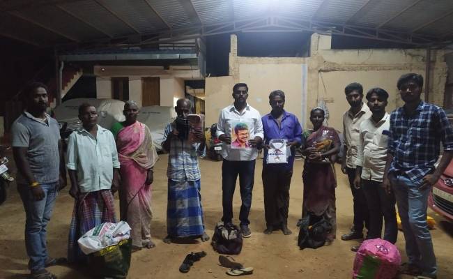 Vijay fans gift new clothes and sweets to cobbler